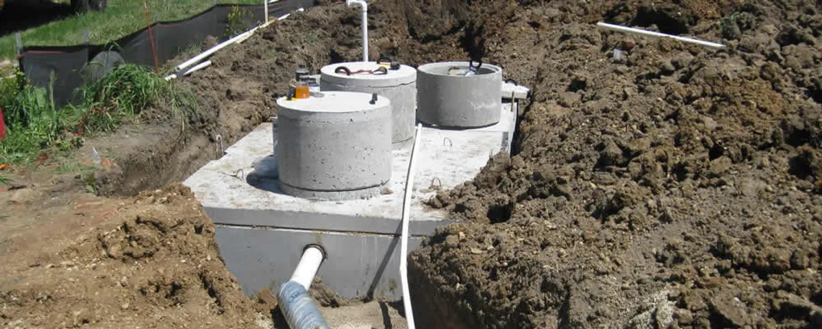 Septic system repair and installation site with tank access ports in Milwaukee, WI